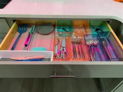 a drawer filled with lots of utensils on a table at Totally 80s! in Sanford
