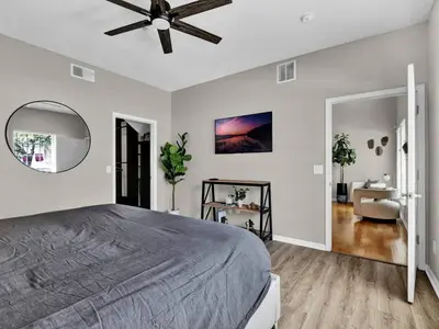 a bedroom with a bed and a ceiling fan at Beautiful townhouse centrally located in Orlando