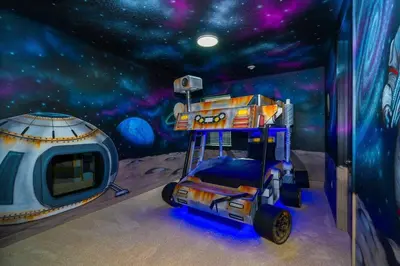 a room with a space bedroom with a mural at EPIC 10min Disney Fun Villa, Mini Golf, Arcade, Theater in Orlando