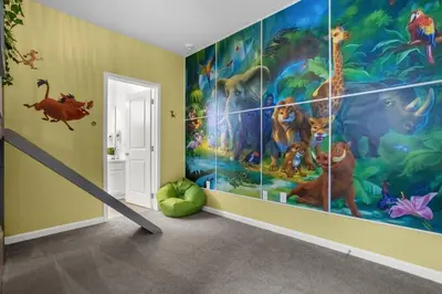 a childrens room with a mural of the lion king at Super Deal - Brand New Themed 9BR Home near Disney in Kissimmee
