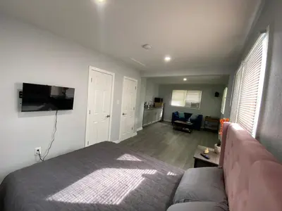 a living room with a bed and a couch at The Oasis in Sanford