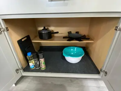 a cupboard with a pot and a bowl in a kitchen at The Oasis in Sanford