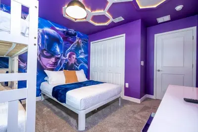 a bedroom with a captain america mural on the wall at WonderFul 4Bd w Pool Close to Disney at StoreyLake 2669 in Kissimmee