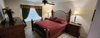 a bedroom with a bed and a ceiling fan at Emerald Island Diamond on the Island in Kissimmee