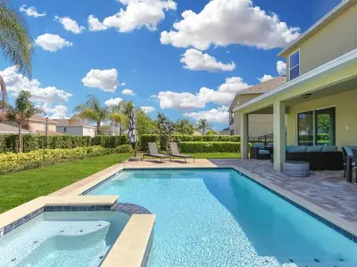 a swimming pool in the backyard of a house at Luxurious Villa 9br Encore Resort near to Disney in Orlando