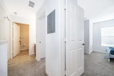 a room with white walls and a white door at Enchanted Townhome near Disney Parks 3Br in Kissimmee