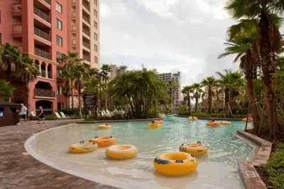 a swimming pool with yellow inflatables in a resort at Bonnet Creek 2 Bedroom Deluxe in Orlando
