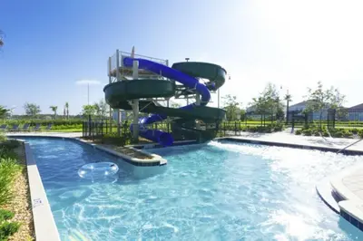 a water slide in a pool at a resort at Elegant Apartment 3BR2BA • Near Disney • PoolLazy River at Storey Lake Resort SL47318 in Kissimmee