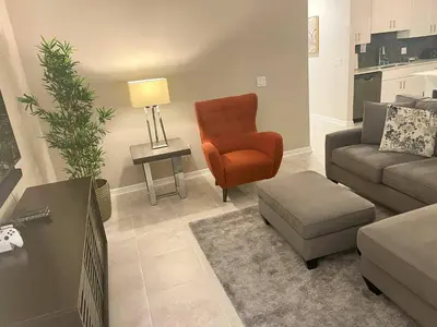 a living room with a couch and a chair at Spacious Apartment 2BR2BA • Near Disney • PoolLazy River at Storey Lake Resort SL47317 in Kissimmee