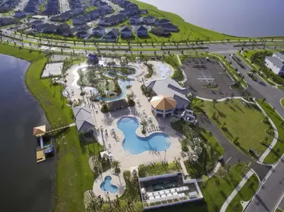 an aerial view of a resort with two pools at Modern Apartment 2BR2BA • Near Disney • Storey Lake Resort SL47314 in Kissimmee