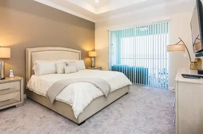 a bedroom with a large bed and a window at Exceptional Apartment 4BR3BA • Near Disney • PoolLazy River at Storey Lake Resort SL47512 in Kissimmee