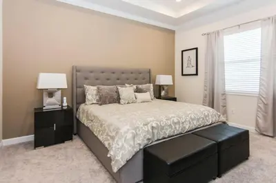 a bedroom with a bed with two night stands and two lamps at Exceptional Apartment 4BR3BA • Near Disney • PoolLazy River at Storey Lake Resort SL47512 in Kissimmee