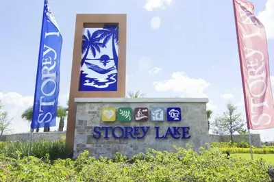 a sign for a showy lake with two flags at Splendid Apartment 4BR3BA • Near Disney • PoolLazy River at Storey Lake Resort SL47512 in Kissimmee