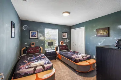 a bedroom with two beds and a captain america room at Premium 5BE4BA Home with Private Pool and Game Room Storey Lake Resort SL4839 in Kissimmee