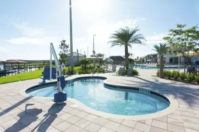 a pool at a resort with palm trees at Premium 5BE4BA Home with Private Pool and Game Room Storey Lake Resort SL4839 in Kissimmee