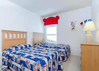 a bedroom with two beds and a window at Emerald Island Kissimmee in Kissimmee