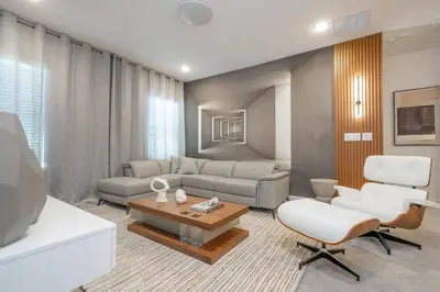 a living room with a couch and a table at Brand New Top Elegance Home at Paradiso 6086 in Orlando
