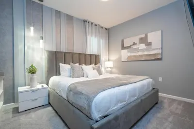 a bedroom with a large bed in a room at Brand New Top Elegance Home at Paradiso 6086 in Orlando
