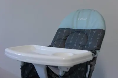 a baby seat with a helmet on top of it at Comfy Modern House w Pool Perfect Location in Orlando