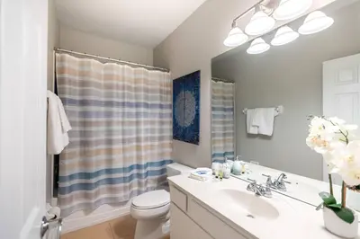 a bathroom with a sink and a toilet at 3BR Townhouse w Perfect Location in Orlando