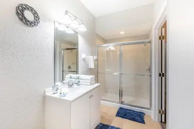 a bathroom with a white sink and a shower at 3BR Townhouse w Perfect Location in Orlando