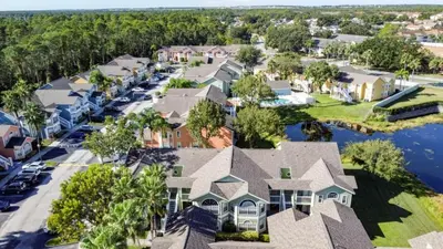 an aerial view of a residential neighborhood with houses at Lovely 3 bed Condo Near Disney Quiet Community condo in Kissimmee