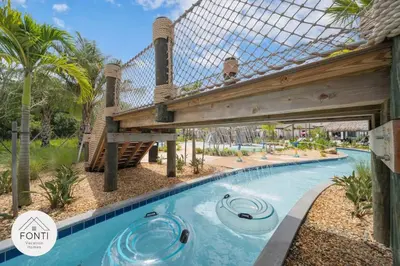 a pool at the resort with a roller coaster at NEW! House in Resort Waterpark Disney Orlando 2693 in Kissimmee
