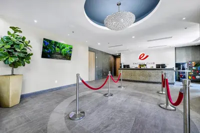 a lobby with red ribbon barriers in front of a pharmacy at Family Friendly Home With Private Pool, Game Room, Waterpark & Resort Access Near Disney At Encore Resort - 7638Wi in Kissimmee