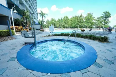 a hot tub in the middle of a courtyard at Orlando Apt 10th floor 5 min from Disney in Orlando