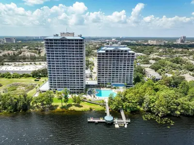 an aerial view of two tall buildings on the water at Apt Orlando 11th Floor 5 min from Disney in Orlando