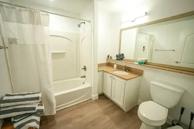 a bathroom with a toilet and a sink and a shower at Renovated Condo Blue Heron 5 pax in Orlando