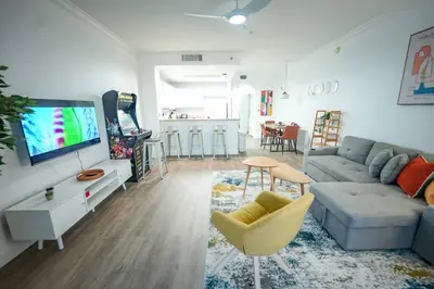 a living room with a couch and a tv at Renovated Condo Blue Heron 5 pax in Orlando