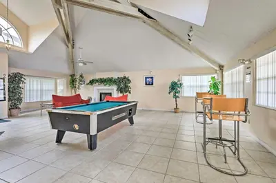 a large room with a pool table in it at 6 Mi to Disney Family-Friendly Condo in Kissimmee in Kissimmee