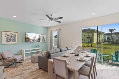 a living room with a couch and a table at 2959 Castaway Lane in Orlando
