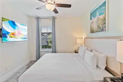 a bedroom with a bed and a ceiling fan at 2959 Castaway Lane in Orlando