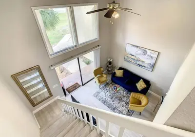 an overhead view of a living room with a ceiling fan at Charming Lakeview Retreat III in Orlando