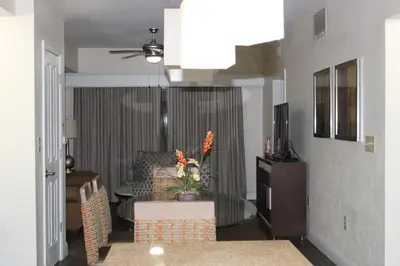 a living room with a couch and a table at Floriday Resort in Orlando