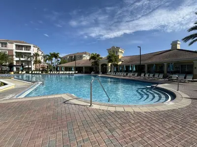 a large swimming pool in a resort at Vista Cay Hideway Luxury Home By Universal Orlando in Orlando