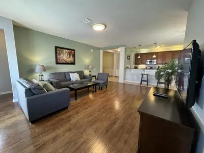 a living room with a couch and a table at Vista Cay Hideway Luxury Home By Universal Orlando in Orlando