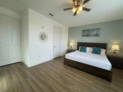 a bedroom with a bed and a ceiling fan at Vista Cay Getaway Luxury By Universal Orlando in Orlando