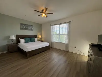 a bedroom with a bed and a ceiling fan at Vista Cay Getaway Luxury By Universal Orlando in Orlando