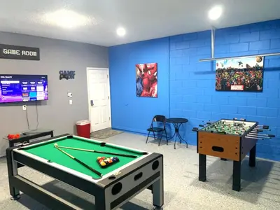 a room with a pool table and a game room at Complete Vacation in exclusive 7 Bed resort home, in Kissimmee