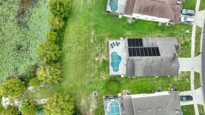 an overhead view of a house with a solar panel at Star Oasis at Citrus Ridge by Shine Villas 091 villa in Orlando