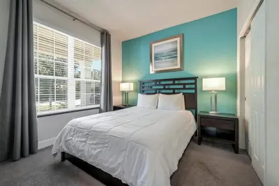 a bedroom with a large bed and a window at Charming Villa with Private Pool Bliss in Orlando