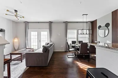 a living room with a couch and a table at Freshly Redesigned 4BR at West Lucaya WL3211 in Kissimmee