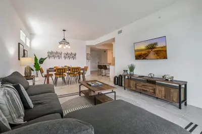 a living room with a couch and a table at Spacious Beautiful 3-BR Condo Prime Location in Kissimmee