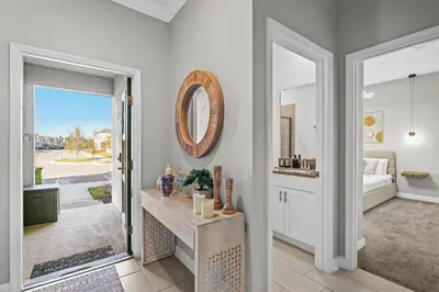a room with a bathroom with a bed and a mirror at House with pool in resort in Kissimmee