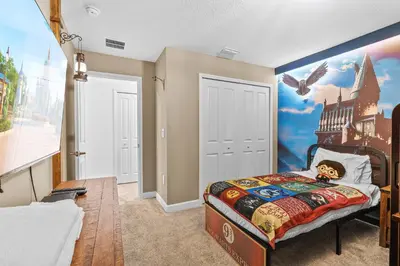 a bedroom with a castle mural on the wall at House with pool in resort in Kissimmee
