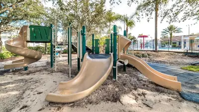 a group of slides at a playground at 2217 Wyndham Palms in Kissimmee