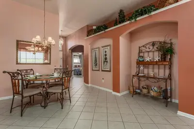 a dining room with a table and chairs at 2217 Wyndham Palms in Kissimmee